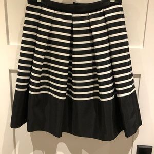 Skirt with box pleats. Black and white stripe